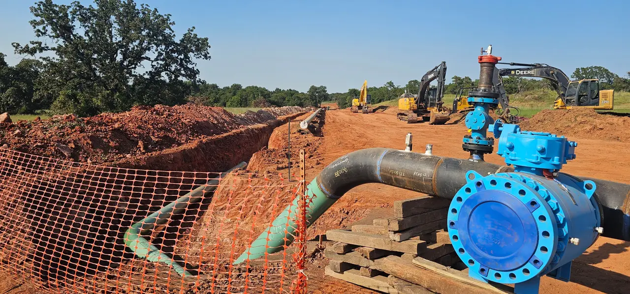 Pipeline right of way cleared and excavated with new valve and pipe set in the trench, ROW clearing in central Oklahoma